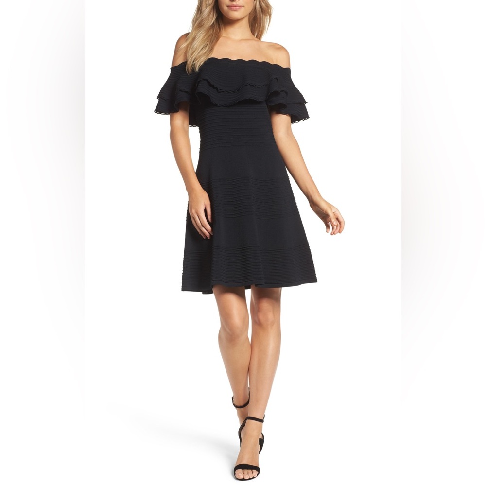 Off the shoulder, black fit & flare dress. Super flattering and well made. 🖤👗